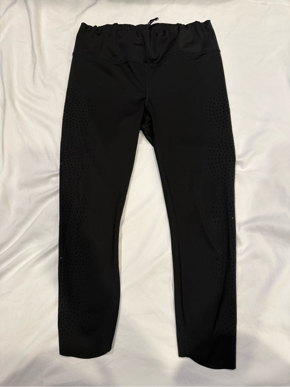 Athleta Women’s 7/8 Cropped black leggings laser dots on sides - Size M